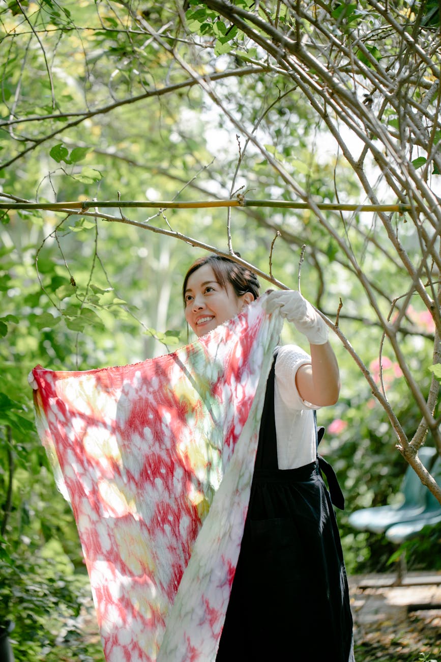 woman with color design fabric in garden